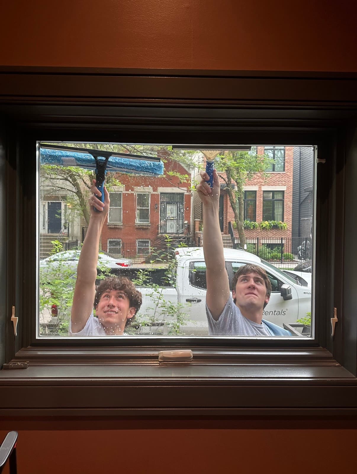 Jake and Reid, squeegees on the glass