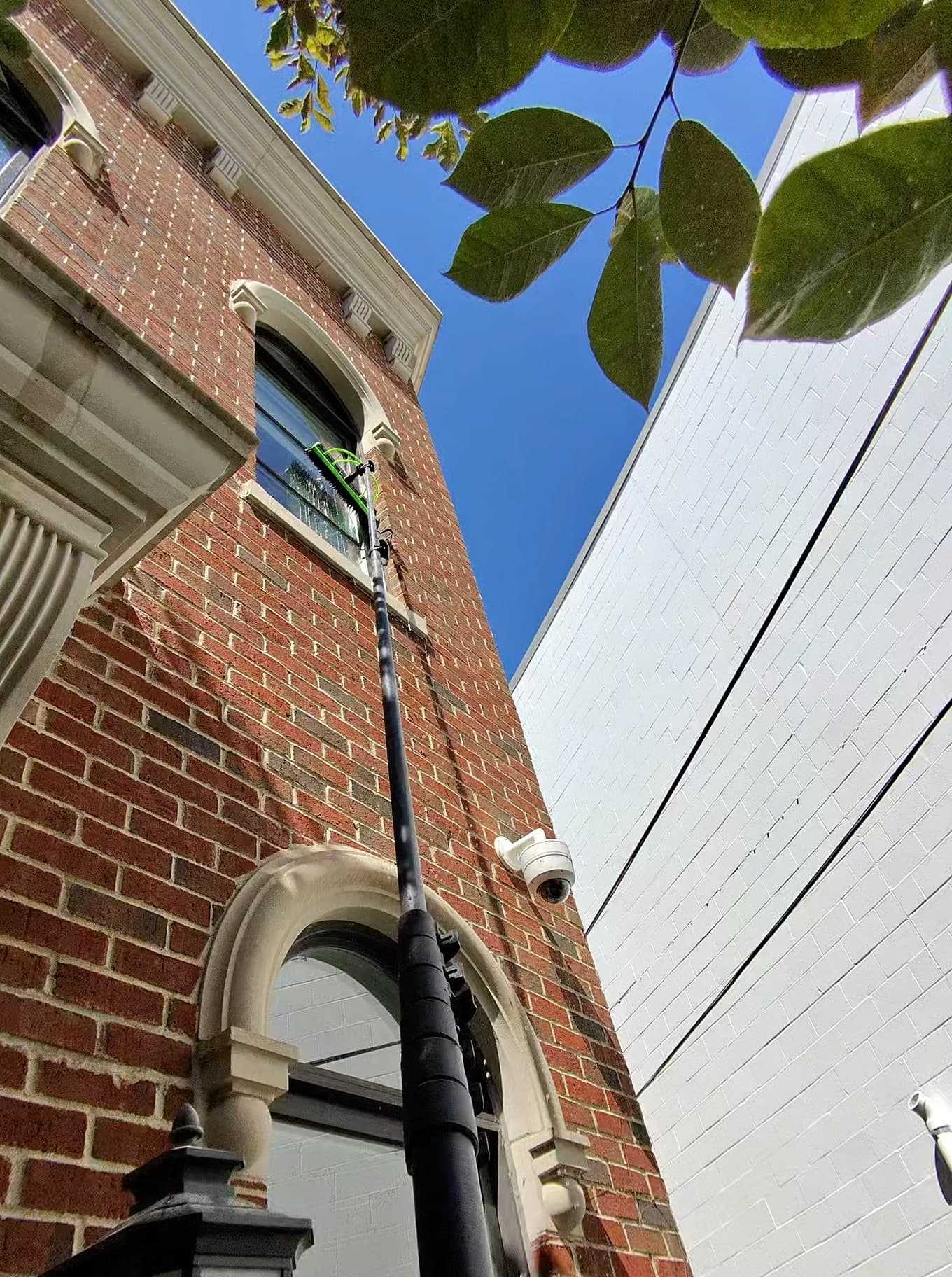 pole work in a tight brick alley