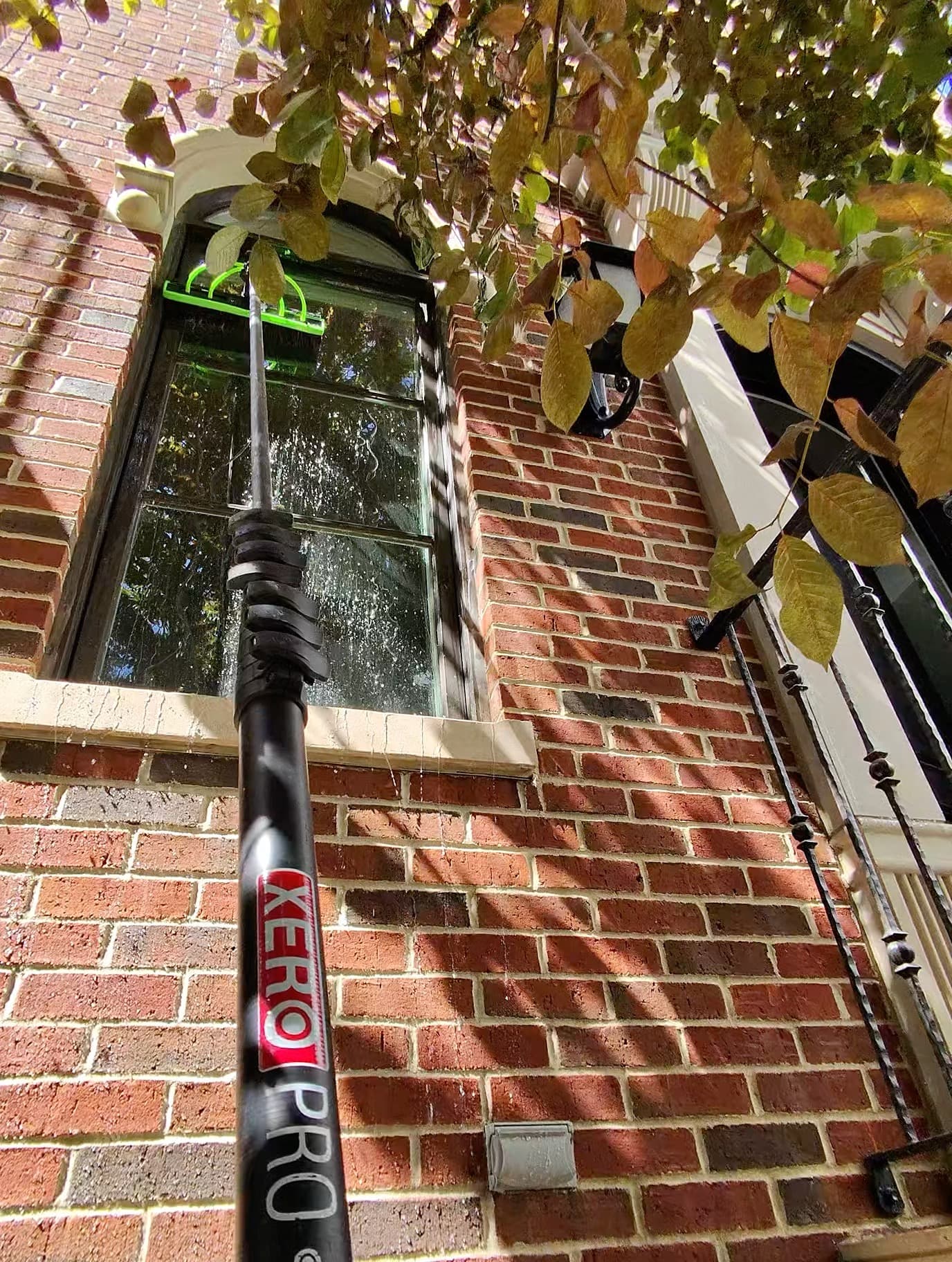 Xero pole cleaning an arched window